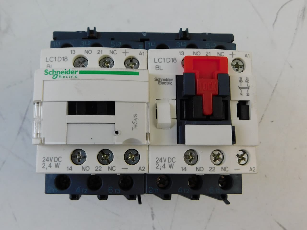Schneider Electric LC2D18BL Schneider Electric LC2D18BL is a pre-assembled reversing magnetic contactor from the Deca sub-range, designed with a low-consumption coil that consumes less than 2.4W. It features a mechanical interlock and screw connections for secure installation. This contactor has 2 x 3-poles (2x3P; 2x3NO) and is rated for a current of 32A under AC-1 conditions and 18A at 440Vac under AC-3 conditions. It offers a degree of protection rated at IP20 and operates with a control voltage (DC) range of 19.2-30Vdc, with a nominal 24Vdc. The rated operating voltage (Ue) is up to 690 V. It includes 2 Normally Open (NO) auxiliary contacts and 2 Normally Closed (NC) auxiliary contacts, with a contact type of 1NO+1NC instantaneous auxiliary contacts per contactor. The rated impulse voltage (Uimp) is 6 kV. Its rated active power ranges from 4kW at 220-230Vac to 10kW at 660-690Vac under AC-3 conditions. The rated power in horsepower (HP) varies from 1HP at 115Vac in single-phase to 15HP at 575-600Vac in three-phase, according to UL/CSA standards. The phase-to-phase rated voltage (AC) is 690 V. Schneider Electric LC2D18BL Schneider Electric LC2D18BL is a pre-assembled reversing magnetic contactor from the Deca sub-range, designed with a low-consumption coil that consumes less than 2.4W. It features a mechanical interlock and screw connections for secure installation. This contactor has 2 x 3-poles (2x3P; 2x3NO) and is rated for a current of 32A under AC-1 conditions and 18A at 440Vac under AC-3 conditions. It offers a degree of protection rated at IP20 and operates with a control voltage (DC) range of 19.2-30Vdc, with a nominal 24Vdc. The rated operating voltage (Ue) is up to 690 V. It includes 2 Normally Open (NO) auxiliary contacts and 2 Normally Closed (NC) auxiliary contacts, with a contact type of 1NO+1NC instantaneous auxiliary contacts per contactor. The rated impulse voltage (Uimp) is 6 kV. Its rated active power ranges from 4kW at 220-230Vac to 10kW at 660-690Vac under AC-3 conditions. The rated power in horsepower (HP) varies from 1HP at 115Vac in single-phase to 15HP at 575-600Vac in three-phase, according to UL/CSA standards. The phase-to-phase rated voltage (AC) is 690 V.